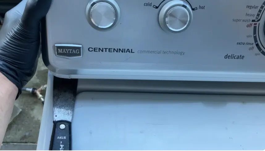 Maytag washing machine being serviced by a technician in Colorado Springs