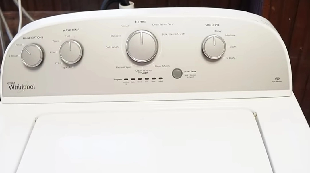 Whirlpool washing machine being serviced by a technician in Colorado Springs